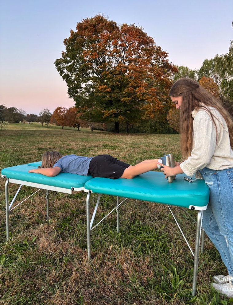 Dr. Shannon providing family-centered chiropractic care outdoors